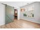 Office room with a barn door and a modern work desk at 214 Harmony Lake Dr, Canton, GA 30115