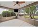 Relaxing screened porch with ceiling fan and TV, offering a serene outdoor retreat at 214 Harmony Lake Dr, Canton, GA 30115