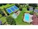 Aerial view of pool, playground, basketball court, tennis courts, and parking at Springmonte community at 2625 Harbor Point Ct, Cumming, GA 30041