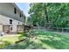 Spacious backyard with lush lawn, deck, and a privacy fence provides a serene outdoor retreat at 2625 Harbor Point Ct, Cumming, GA 30041