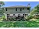 A fenced backyard with a well-maintained lawn and a deck enhances this home's outdoor appeal at 2625 Harbor Point Ct, Cumming, GA 30041