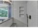 Close up of sleek shower featuring white subway tile and black pebble floor at 2625 Harbor Point Ct, Cumming, GA 30041