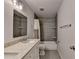 Bathroom featuring double vanity, tiled floors and shower with curtain at 2625 Harbor Point Ct, Cumming, GA 30041