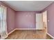 Bedroom with wood floors, mauve walls, and doorway at 2625 Harbor Point Ct, Cumming, GA 30041