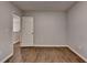 Bedroom with hardwood floors and a doorway to another room at 2625 Harbor Point Ct, Cumming, GA 30041
