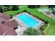 Overhead view of the community pool, surrounded by lounge chairs and well-maintained landscaping at 2625 Harbor Point Ct, Cumming, GA 30041