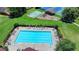 Aerial view of the community pool, playground, and tennis courts offering recreational amenities at 2625 Harbor Point Ct, Cumming, GA 30041