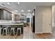 Open concept kitchen with gray cabinets, a center island with bar stool seating, and stainless-steel appliances at 2625 Harbor Point Ct, Cumming, GA 30041