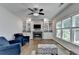 Comfortable living room featuring a fireplace, built-in shelving, and lots of natural light at 2625 Harbor Point Ct, Cumming, GA 30041