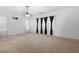 Spacious bedroom with a ceiling fan, carpeted floor, and large windows dressed with curtains at 3309 Raes Creek Rd # 13, Marietta, GA 30008