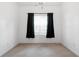 Clean bedroom with carpet floors, white walls and a window with dark curtains at 3309 Raes Creek Rd # 13, Marietta, GA 30008