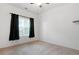 Simple bedroom with a carpeted floor, window with black curtains, and a ceiling fan at 3309 Raes Creek Rd # 13, Marietta, GA 30008