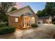 Inviting brick home featuring a charming front porch and attached two-car garage at 3309 Raes Creek Rd # 13, Marietta, GA 30008