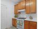 Clean kitchen featuring white countertops and updated stainless steel gas range and hood at 3309 Raes Creek Rd # 13, Marietta, GA 30008