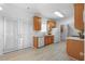 Galley kitchen with light wood cabinets, white countertops, stainless steel sink, and double doors at 3309 Raes Creek Rd # 13, Marietta, GA 30008