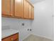 Laundry area showcasing built-in cabinets and light countertops in a utility room at 3309 Raes Creek Rd # 13, Marietta, GA 30008