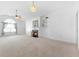 Bright living room featuring a fireplace, vaulted ceilings, and large arched window with natural light at 3309 Raes Creek Rd # 13, Marietta, GA 30008