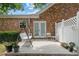 Cozy backyard patio with a swing, chairs, and potted plants at 3309 Raes Creek Rd # 13, Marietta, GA 30008