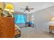 Bedroom featuring an ornate ceiling fan and a window with decor at 4866 S Lilburn Stone Mountain Road Sw, Lilburn, GA 30047