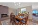 Dining area next to kitchen features chairs, table and fireplace at 4866 S Lilburn Stone Mountain Road Sw, Lilburn, GA 30047