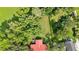 Stunning aerial view of a secluded home nestled within lush green trees and well-manicured landscaping at 4866 S Lilburn Stone Mountain Road Sw Rd, Lilburn, GA 30047