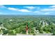 Expansive aerial view of a home, surrounded by dense trees, highlighting its private setting and location at 4866 S Lilburn Stone Mountain Road Sw Rd, Lilburn, GA 30047