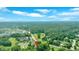 Lovely neighborhood aerial view, featuring lush green trees and blue skies at 4866 S Lilburn Stone Mountain Road Sw Rd, Lilburn, GA 30047