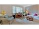 Cozy living room with a piano, comfortable seating, and large window at 4866 S Lilburn Stone Mountain Road Sw Rd, Lilburn, GA 30047