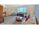 Cozy living room with a piano, comfortable seating, and large window at 4866 S Lilburn Stone Mountain Road Sw Rd, Lilburn, GA 30047