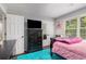 bedroom with a black dresser, window, and light-colored walls at 6492 Swift Creek Road, Lithonia, GA 30058