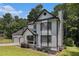 Charming two-story home with black and white trim, and a lush green lawn at 6492 Swift Creek Road, Lithonia, GA 30058