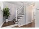 Welcoming foyer with hardwood floors, a staircase, and neutral paint at 6492 Swift Creek Road, Lithonia, GA 30058