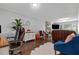 Open-concept living room and office featuring hardwood floors and stylish decor at 6492 Swift Creek Road, Lithonia, GA 30058