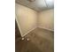 Beige walls, carpeted flooring, and minimal lighting create a simple space at 1 Thorntree Pass, Powder Springs, GA 30127