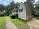A view of the side of the home, highlighting the vinyl siding, driveway and two-car garage at 1 Thorntree Pass, Powder Springs, GA 30127