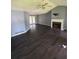 The living room features a fireplace, vinyl floors, and glass doors leading to an outdoor area at 1 Thorntree Pass, Powder Springs, GA 30127
