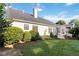 Serene backyard features a patio, lush lawn, and mature landscaping at 10050 Lauren Hall Ct, Alpharetta, GA 30022