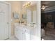 Well-lit bathroom boasting a single sink vanity, and convenient access to the bedroom at 10050 Lauren Hall Ct, Alpharetta, GA 30022