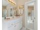 Bright bathroom featuring a white vanity, ample counter space, and a well-lit mirror for daily routines at 10050 Lauren Hall Ct, Alpharetta, GA 30022
