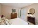 Comfortable bedroom with a closet and dresser, offering ample storage and a serene atmosphere at 10050 Lauren Hall Ct, Alpharetta, GA 30022