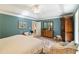 Inviting bedroom showcasing neutral tones, comfortable seating, and decorative artwork for relaxation at 10050 Lauren Hall Ct, Alpharetta, GA 30022