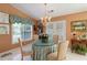 Charming breakfast nook with a round table and decorative floral accents at 10050 Lauren Hall Ct, Alpharetta, GA 30022