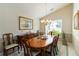 Elegant dining room with a wooden table, chandelier, and decorative accents at 10050 Lauren Hall Ct, Alpharetta, GA 30022