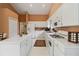 Spacious kitchen featuring white cabinetry, island, and modern appliances at 10050 Lauren Hall Ct, Alpharetta, GA 30022
