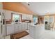 Bright eat-in kitchen with white cabinets, island, and lots of natural light at 10050 Lauren Hall Ct, Alpharetta, GA 30022