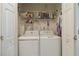 Convenient laundry area with modern appliances, enhancing the functionality of the home at 10050 Lauren Hall Ct, Alpharetta, GA 30022