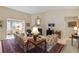 Bright living room featuring a fireplace, and traditional furniture arrangement at 10050 Lauren Hall Ct, Alpharetta, GA 30022