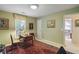 Versatile office space featuring a classic desk and chair setup, promoting a focused work environment at 10050 Lauren Hall Ct, Alpharetta, GA 30022