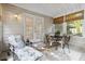 Charming sunroom with seating, perfect for relaxing and enjoying the outdoor views at 10050 Lauren Hall Ct, Alpharetta, GA 30022
