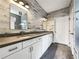 Stylish bathroom with double vanity, modern lighting, and elegant finishes at 2838 Menton Rd, Powder Springs, GA 30127